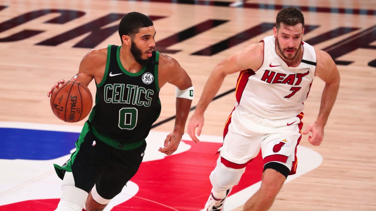 Boston Celtics forward Jayson Tatum (0) moves the ball against Miami Heat guard Goran Dragic (7) during the second half in game five of the Eastern Conference Finals of the 2020 NBA Playoffs at Advent...